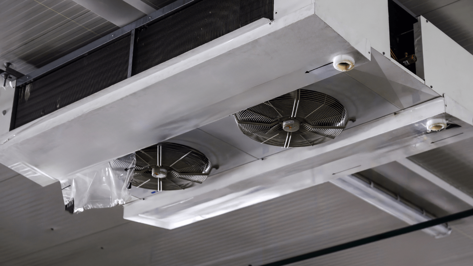 Commercial ceiling mounted HVAC unit with ventilation fans in Des Moines Iowa